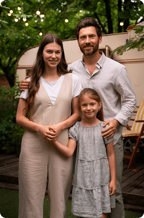 Happy family outside in front of their RV.  AOG Group | Allstate