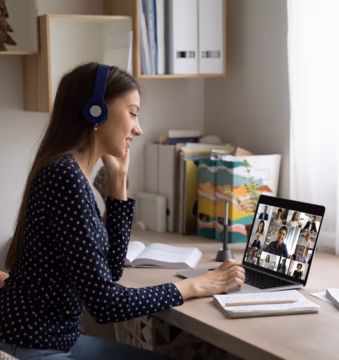 Woman on virtual meeting call, engaging in digital grief healing and community resilience research remotely.