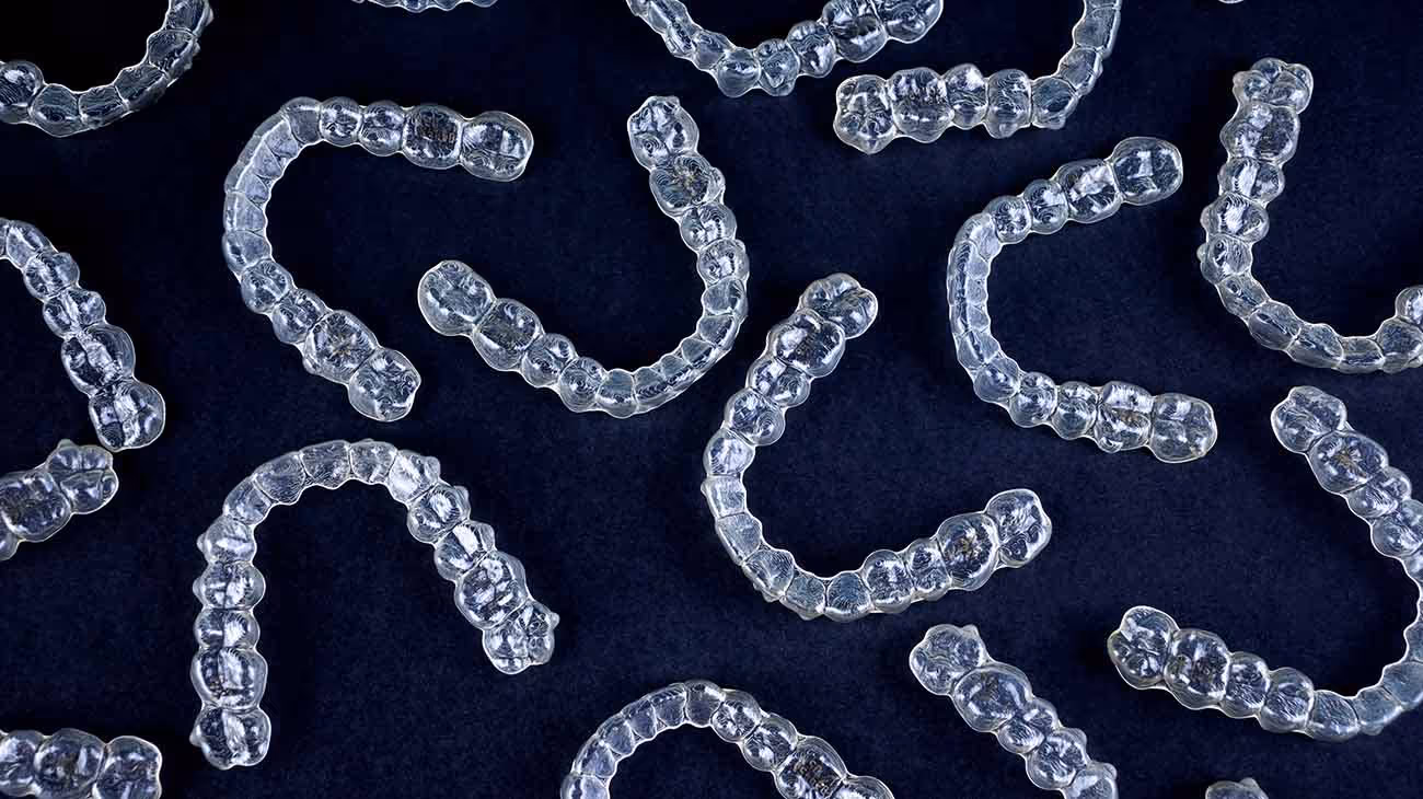 Dental aligner recycling program showing collected orthodontic devices