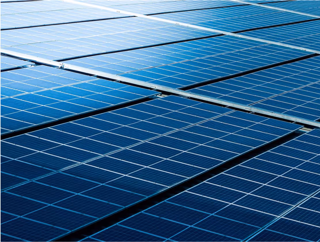 Solar panel recycling program showing collected photovoltaic panels and equipment