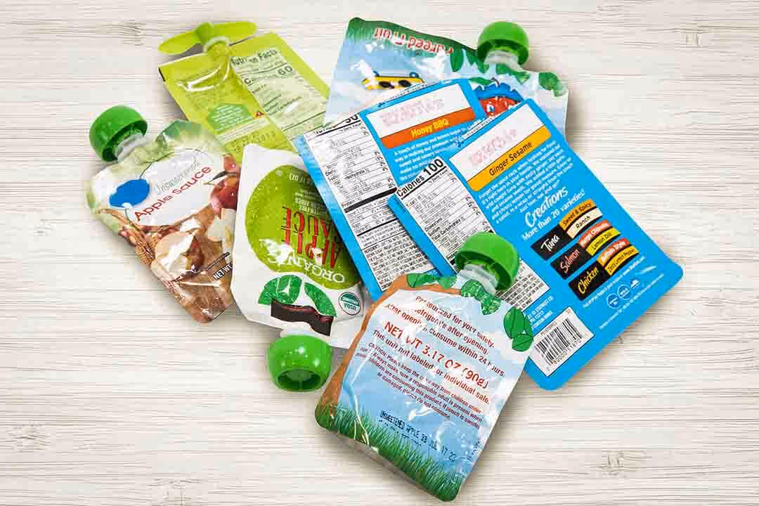 Food packaging recycling program showing collected snack wrappers and containers