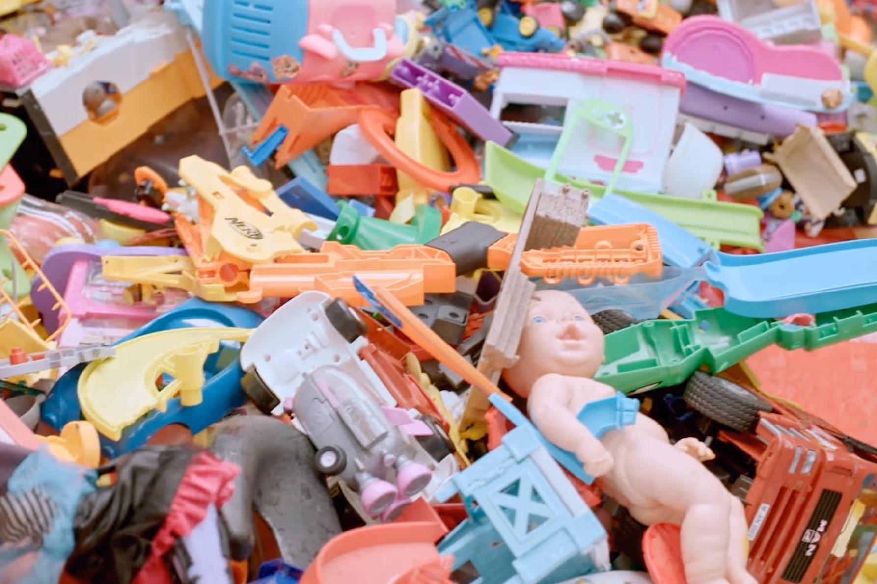 Toy recycling program showing collected children's toys and play equipment