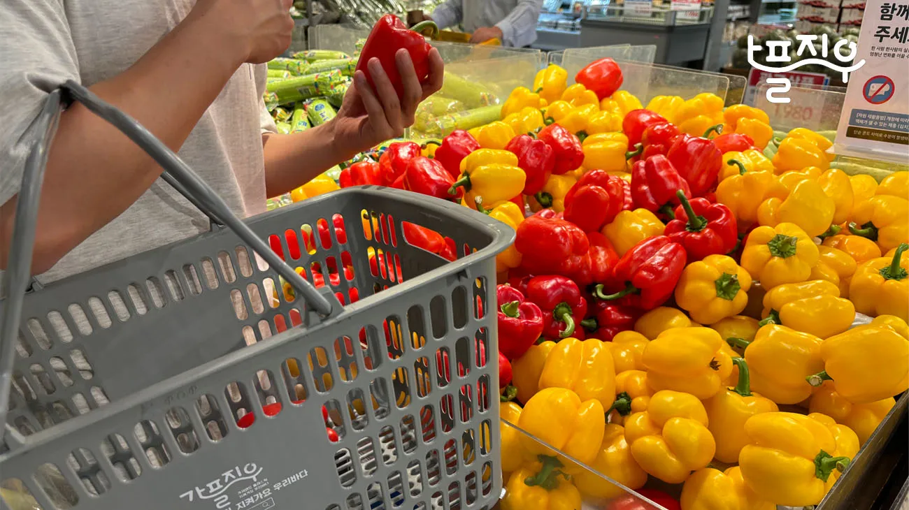 A stack of reusable shopping bags made from recycled materials, part of Emart's partnership with TerraCycle.
