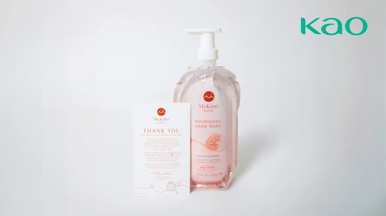 A person holding a recycled plastic pellet made from KAO cosmetic packaging, a result of TerraCycle's closed-loop process.