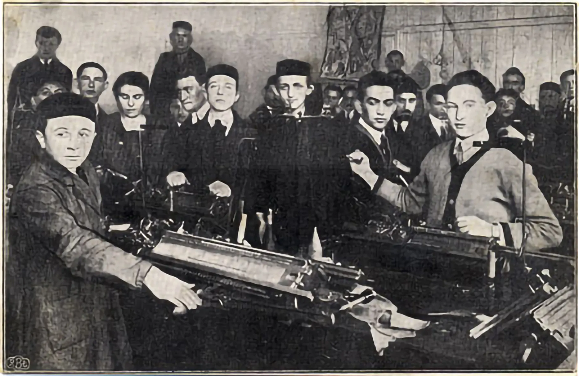 Jewish orthodox youngsters being taught mechanical knitting skills in an ORT workshop. (Lodz, c.1914