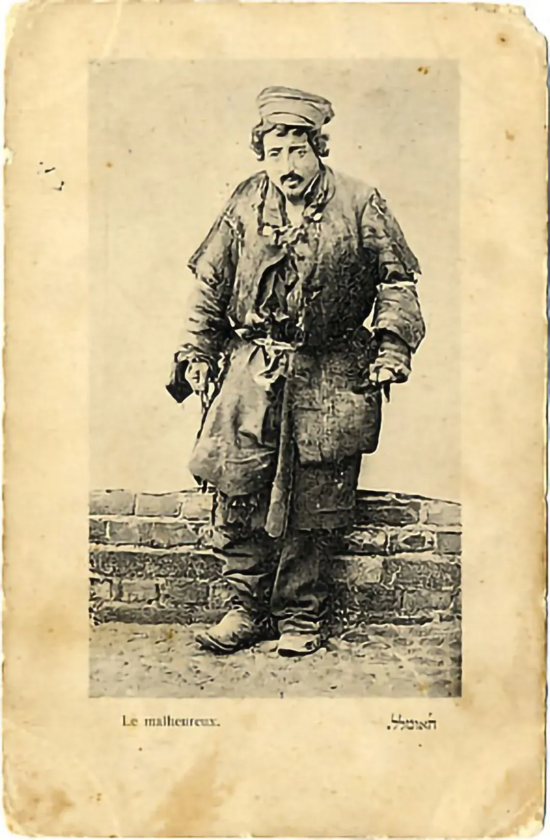 A poor Jewish man, dressed in rags, poses for a portrait. (Warsaw, date unknown)
