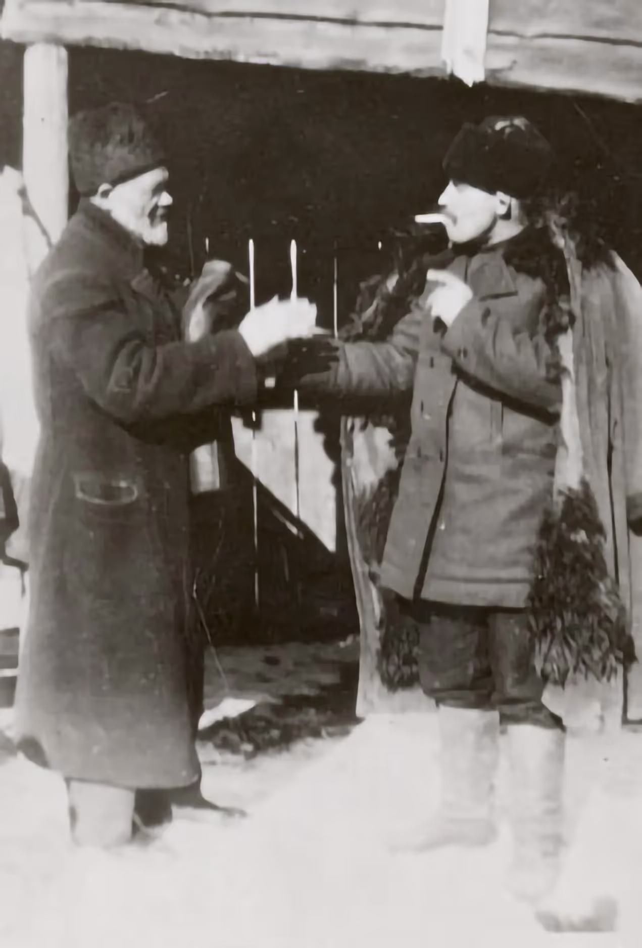 Jewish man slapping a peasant's hand to signify the closing of a business deal (place unknown, 1920s).