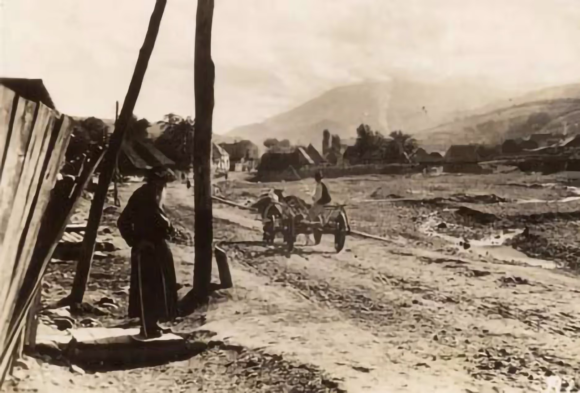 Peasant in a cart passing an elderly Jewish man near a village in a mountainous area (Maramos, Romania, 1930s).
