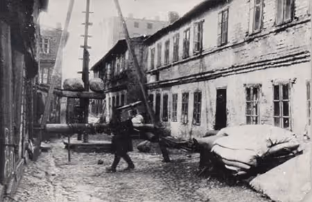 The Baluty Neighborhood in the 1920's: bedding laid out near a well in a courtyard in a poor Jewish neighborhood on the eve of Passover.