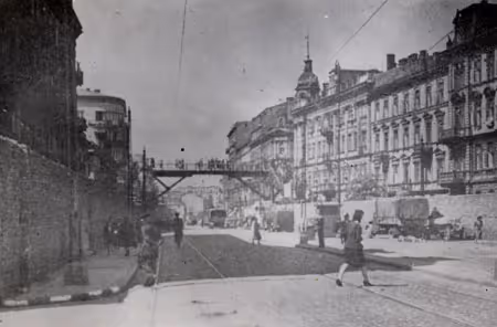 A footbridge connecting the "Large Ghetto" to the "Small Ghetto" in Warsaw.  The bridges allowed trams and larger through ways to pass through the ghetto (Warsaw, circa 1941).
