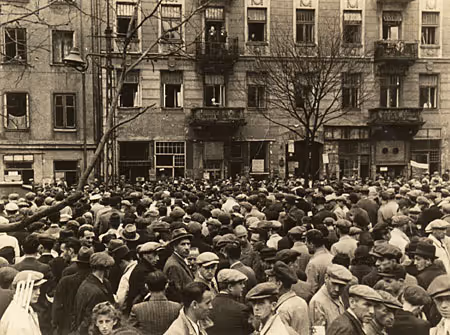 Milling throngs in the Warsaw Ghetto, perhaps listening to a radio loudspeaker (Warsaw, circa 1941).
