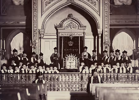 Portrait of Cantor Pinchas Minkovski and the boys' choir in front of the ark in the Brody Synagogue, built in the 1840s (Odessa, circa 1910).
