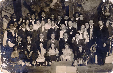 The Khaveyrim Trupe, a Yiddish theater cooperative, on stage in costume (Lublin, 1926).
