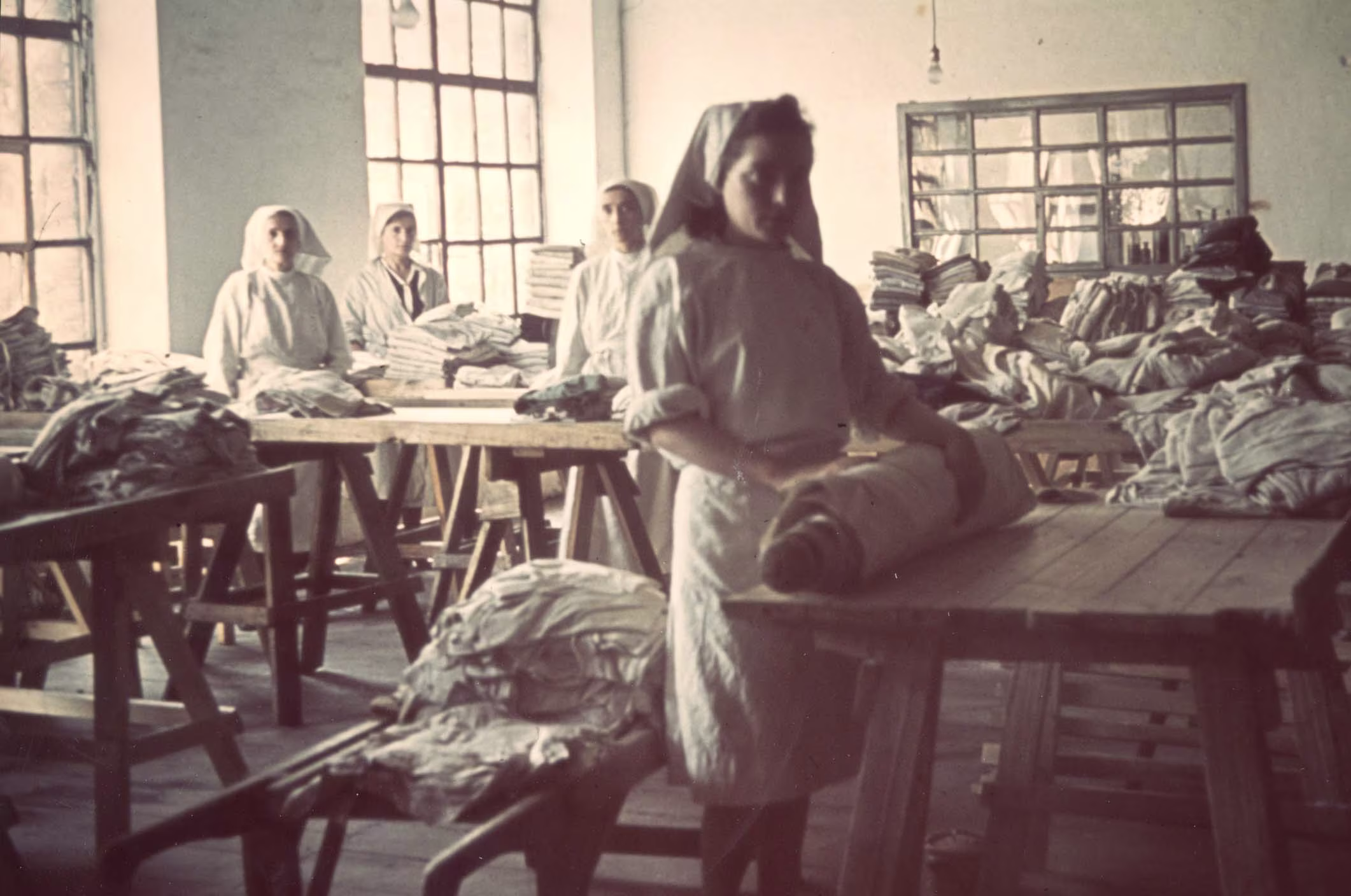 Lodz, Poland, Women working in the ghetto laundry. Credit - Jewish Museum Frankfurt
