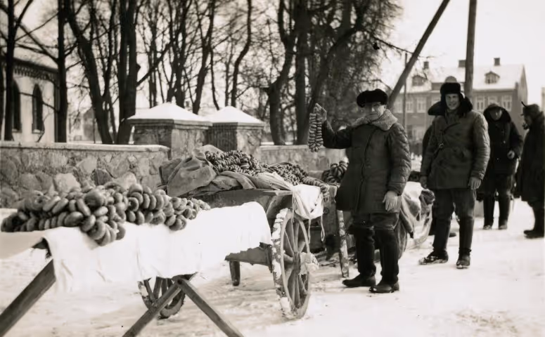 A bagel seller with his wares, Biržai, Lithuania, 1938. (YIVO)