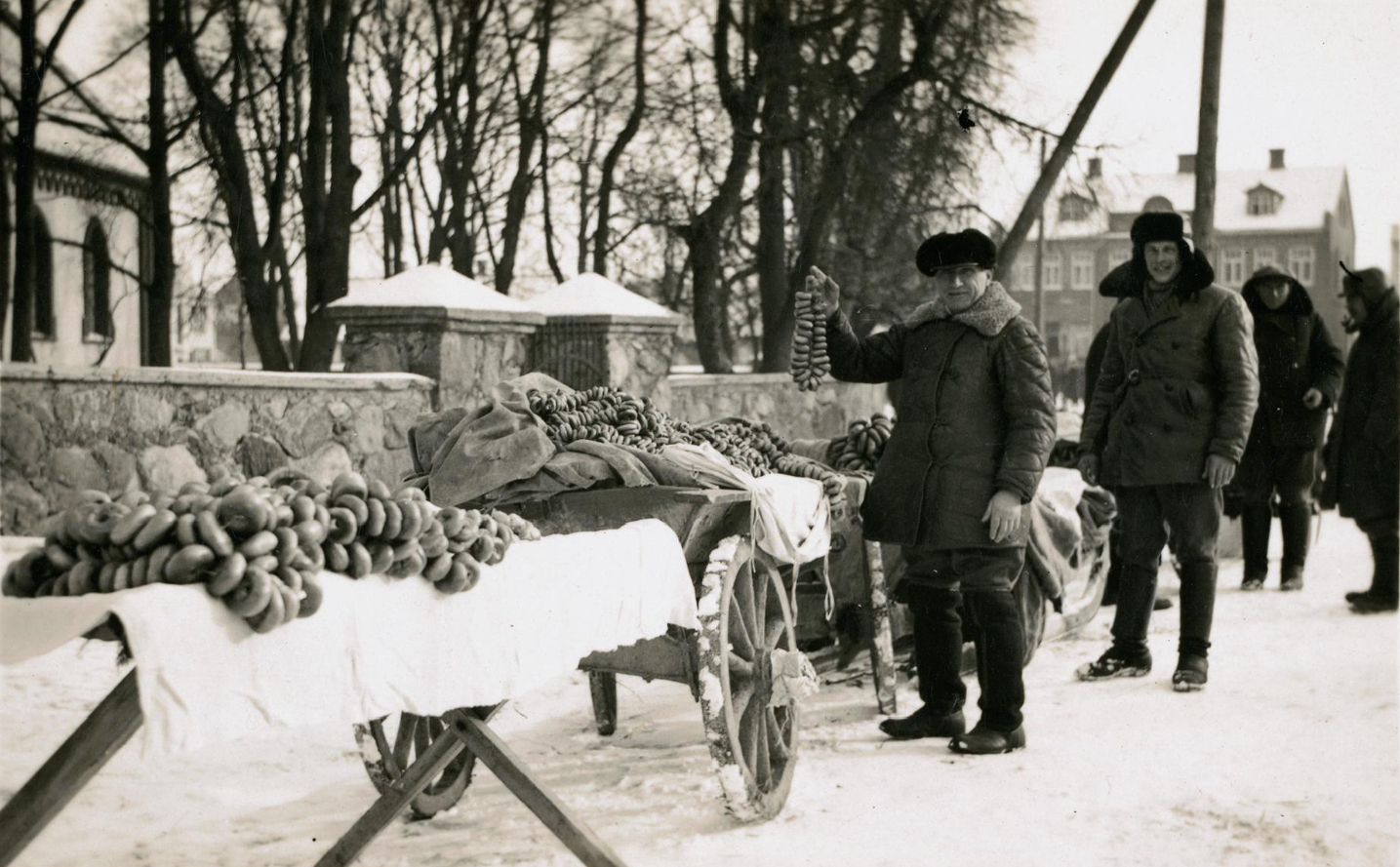 A bagel seller with his wares, Biržai, Lithuania, 1938. (YIVO)