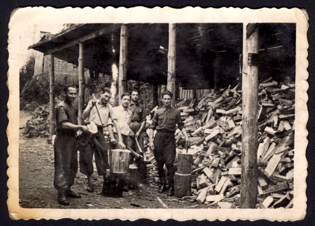 Vilna, Poland, Shepsel Prushan and other men chopping wood. Source Central Historical Museum in Estonia. Credit Yad Vashem