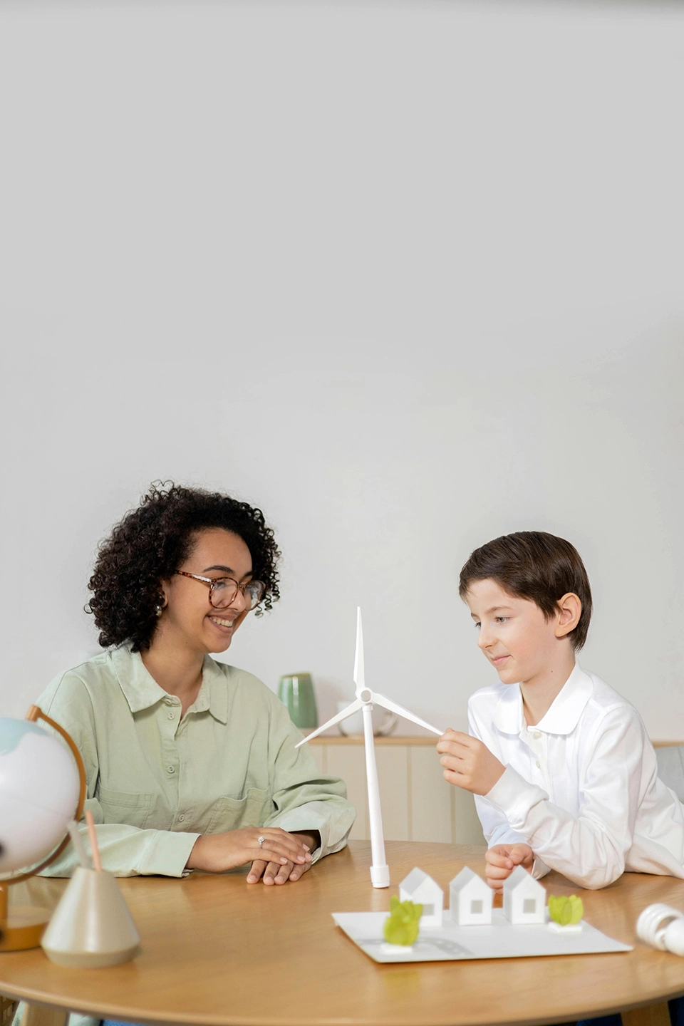A teacher coaches their student through a creativity and problem exercise.