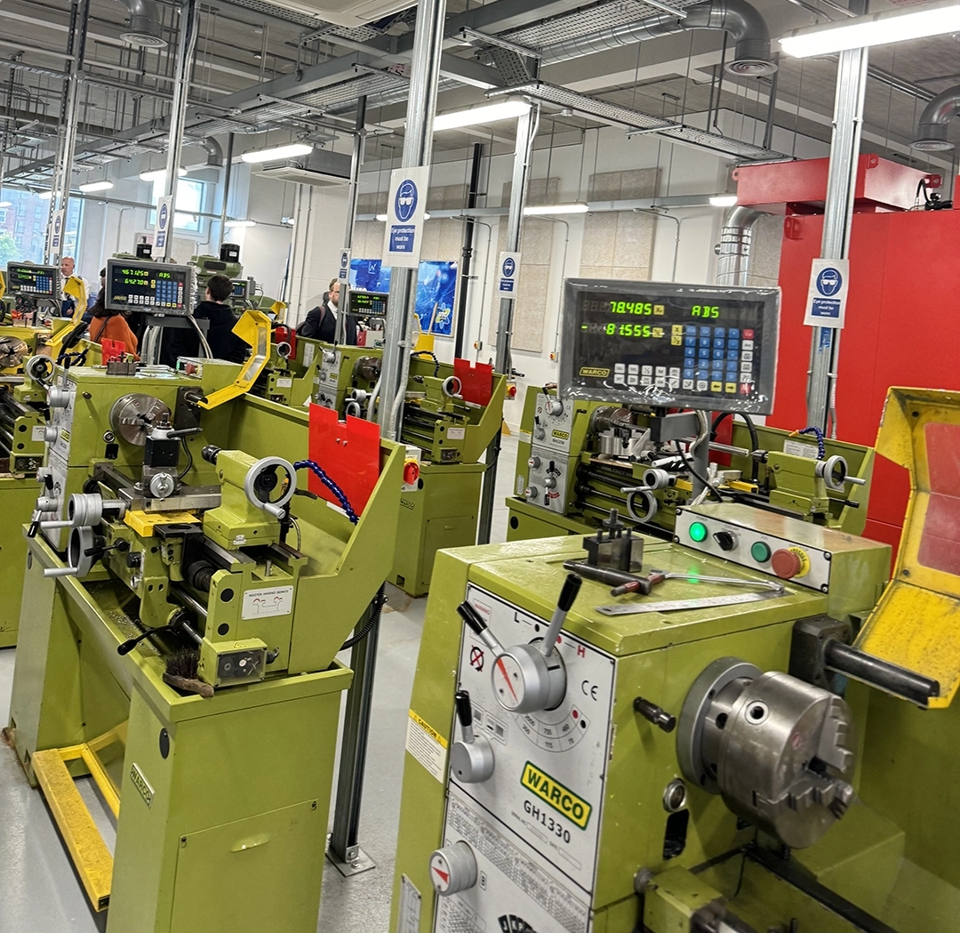 A room full of lathes and other industrial equipment in a Design & Technology studio on UTC Warrington's campus.