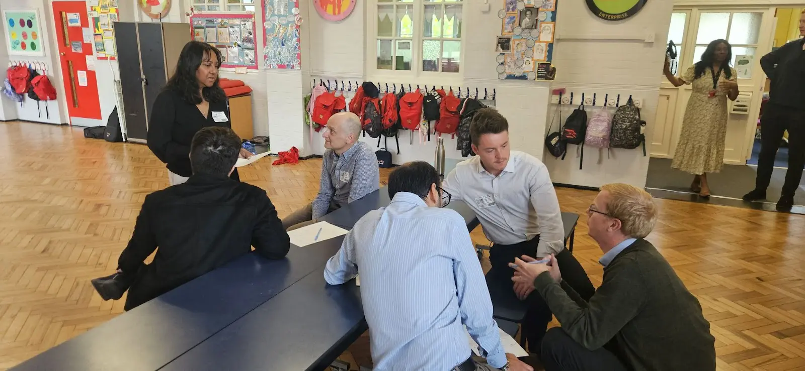 (Volunteers from Kyndryl and UK Power Networks preparing to give feedback to Year 3 imaginative inventors)
