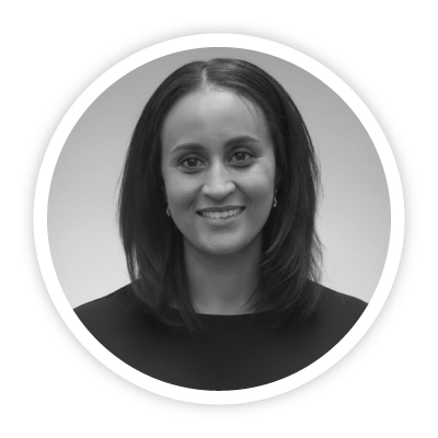 An image of Sophie Deaville, Head of Global Programmes at Skills Builder Partnership. She wearing a black formal dress and a shoulder-length haircut. She is smiling warmly and confidently.