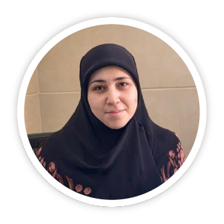 A portrait photo of Sokaina. A Lebanese woman wearing a black hijab and a warm, kind smile.