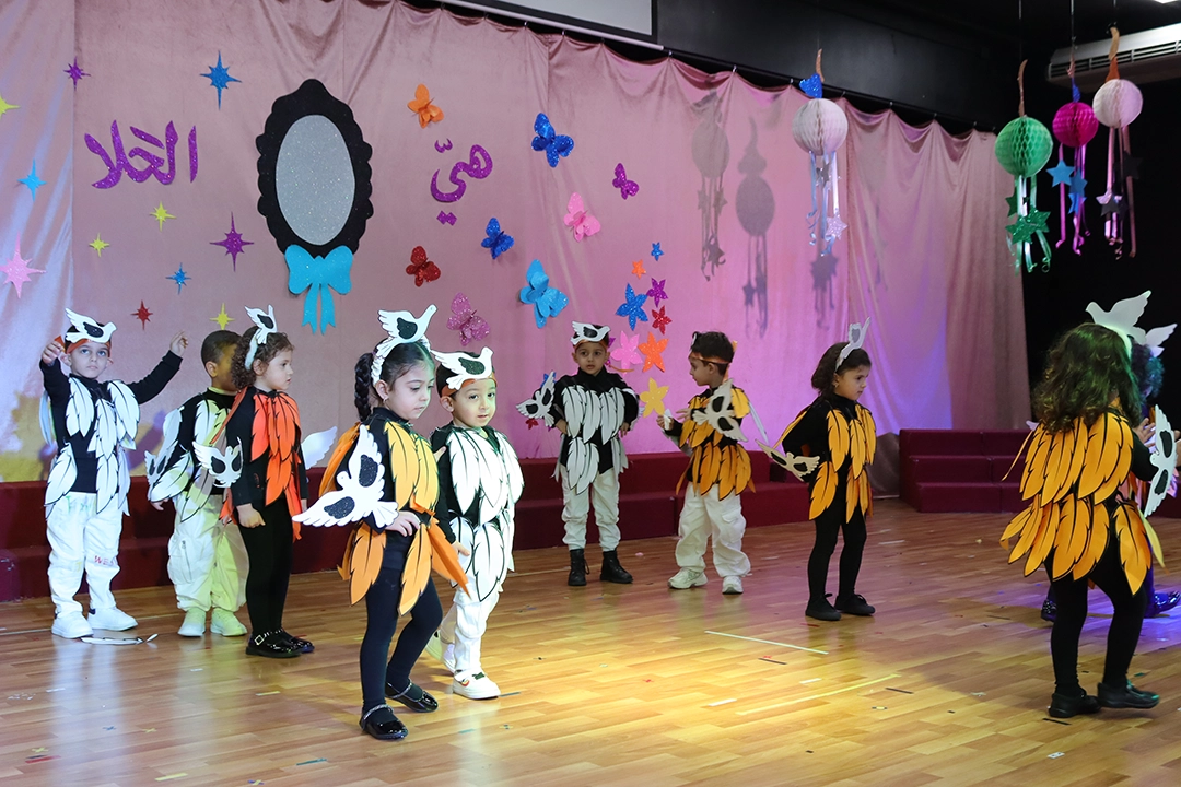 A group of young pupils from Imam Al-Hassan school dressed-up in dove costumes taking part in a school play to celebrate Mothers' day.