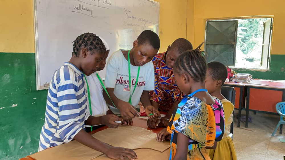 An image of school children learning in an arts and crafts class