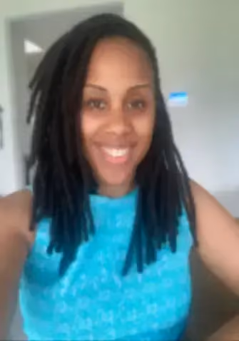 Smiling woman in bright blue top