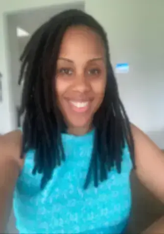 Smiling woman in bright blue top