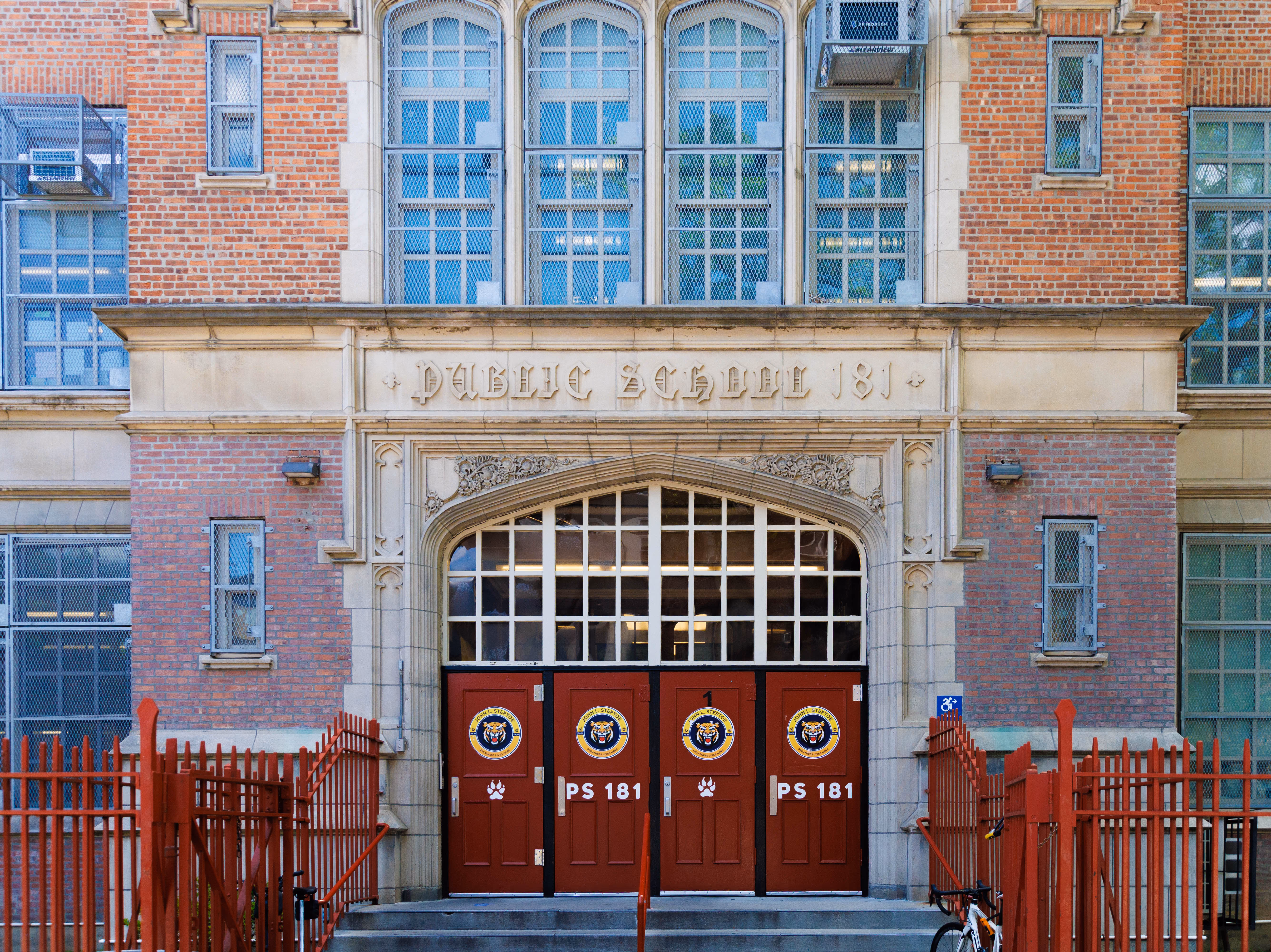 Front entrance of Public School 181 red brick building