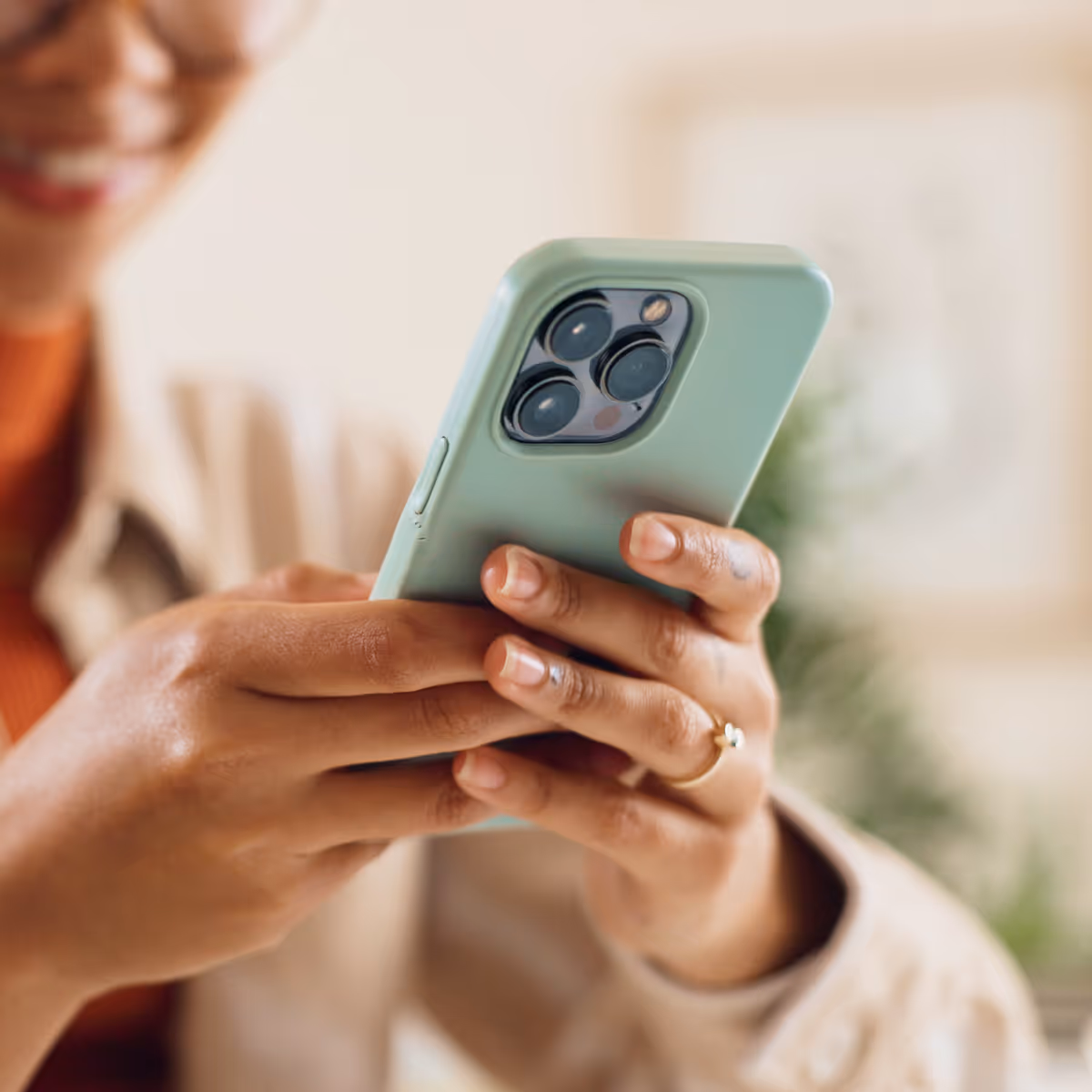 A close up of a person holding a cell phone.
