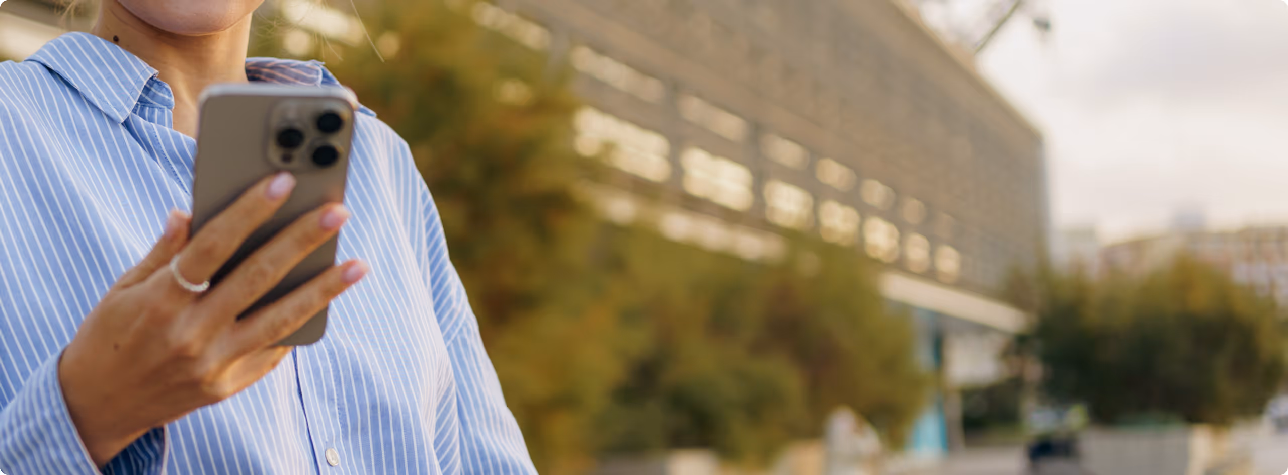 A woman holding a cell phone in her hands.