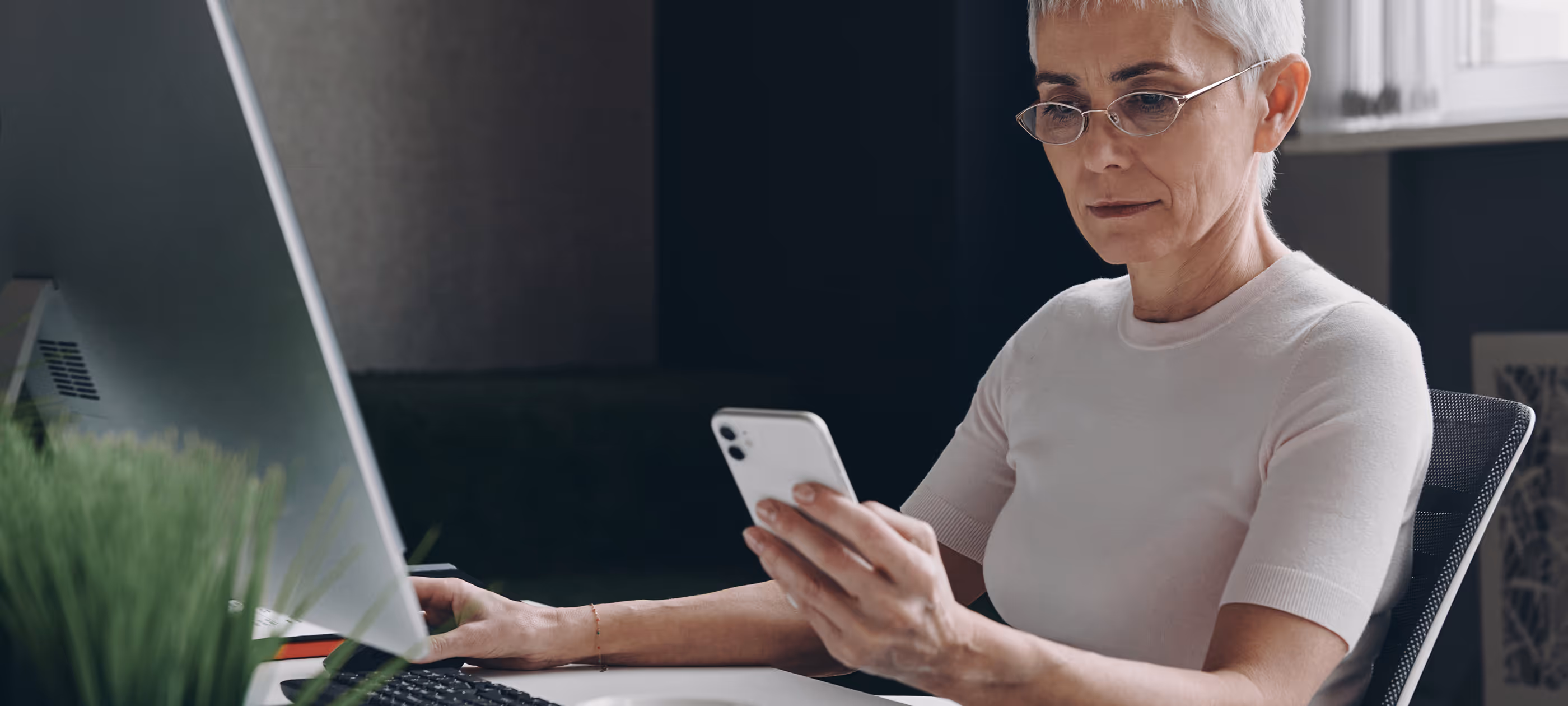 A woman sitting in front of a laptop computer.