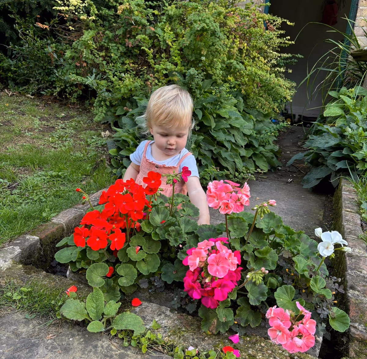 Zara outside looking at flowers