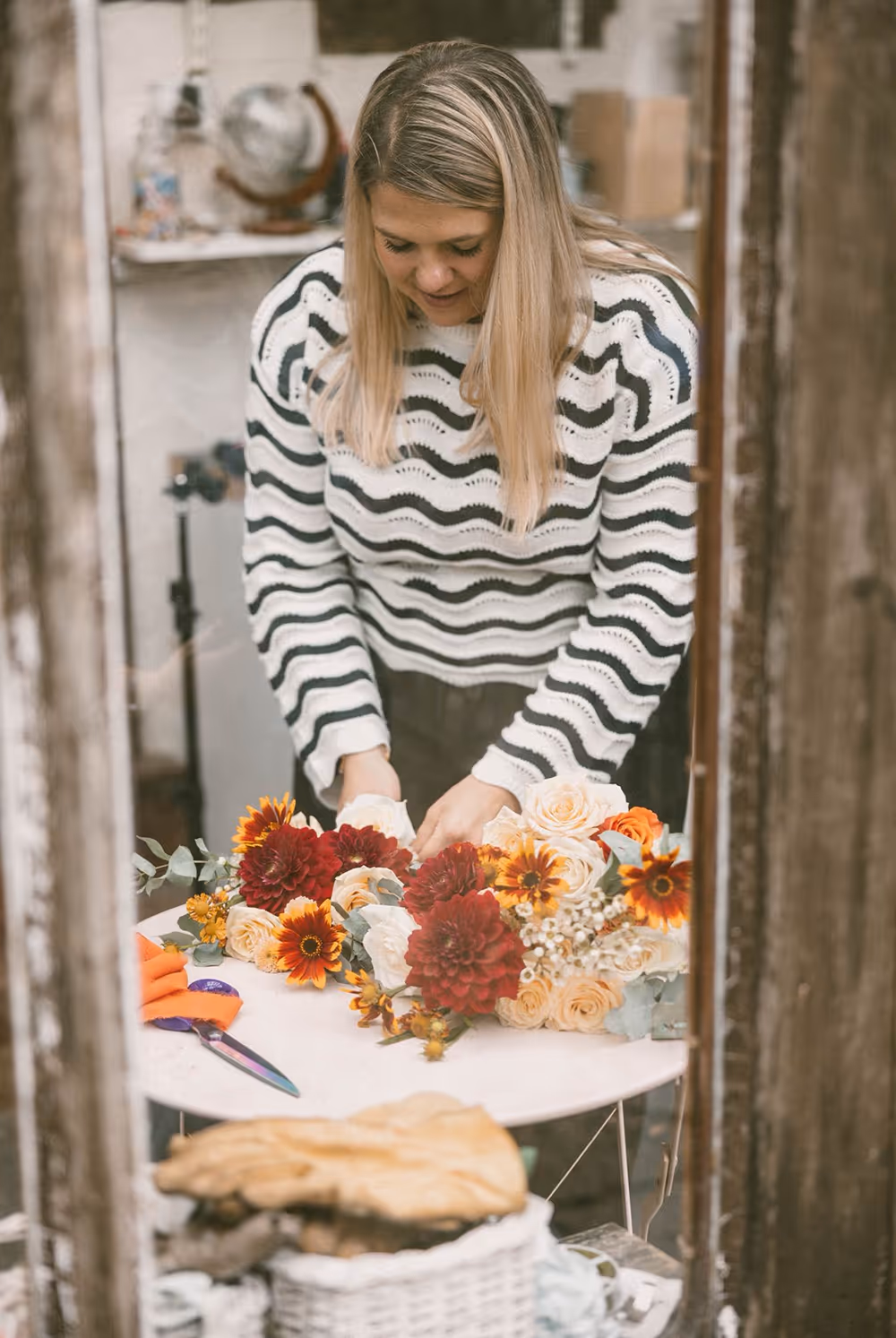 Maddy working on flowers on a table