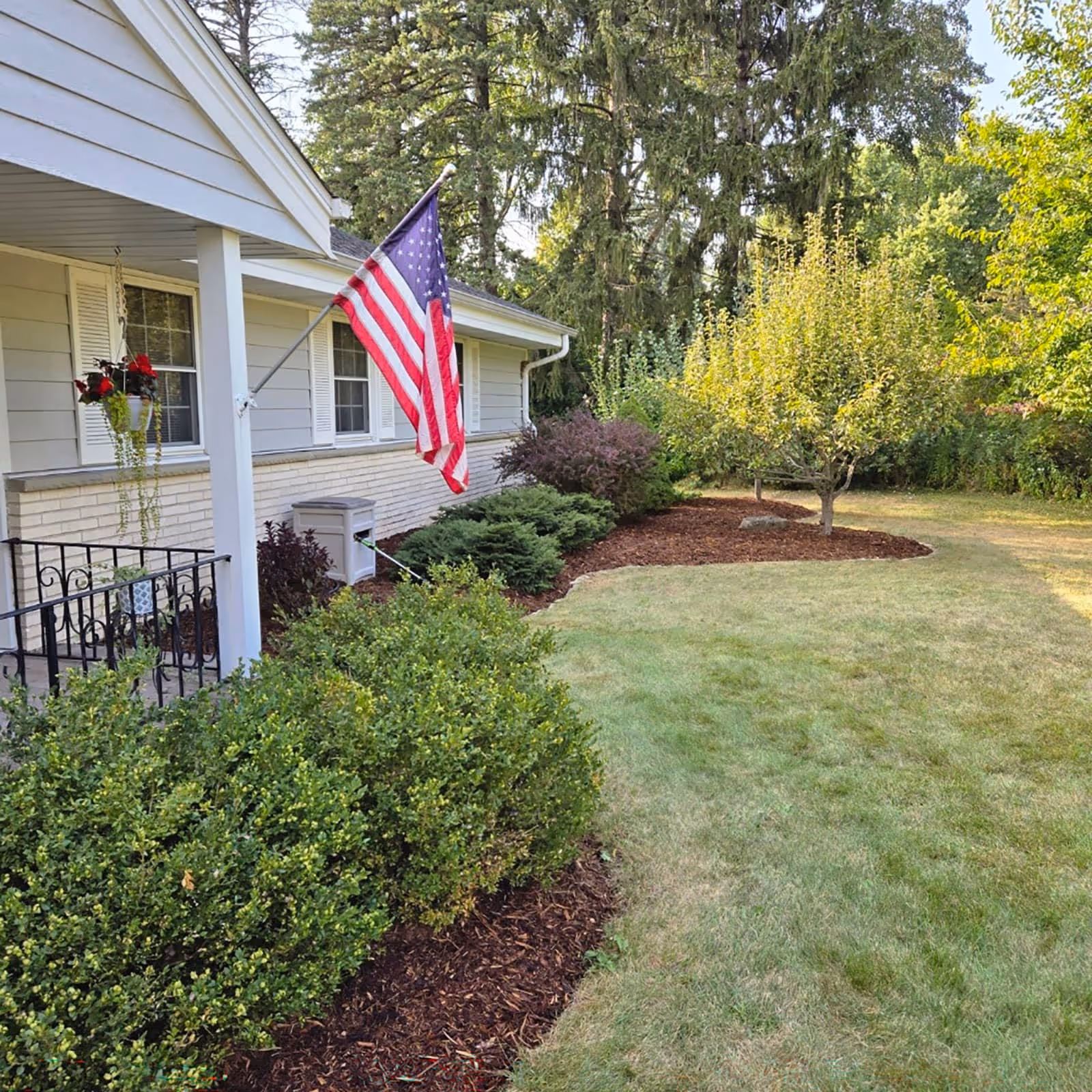 Shrub pruning and bush trimming service improving curb appeal in Racine County