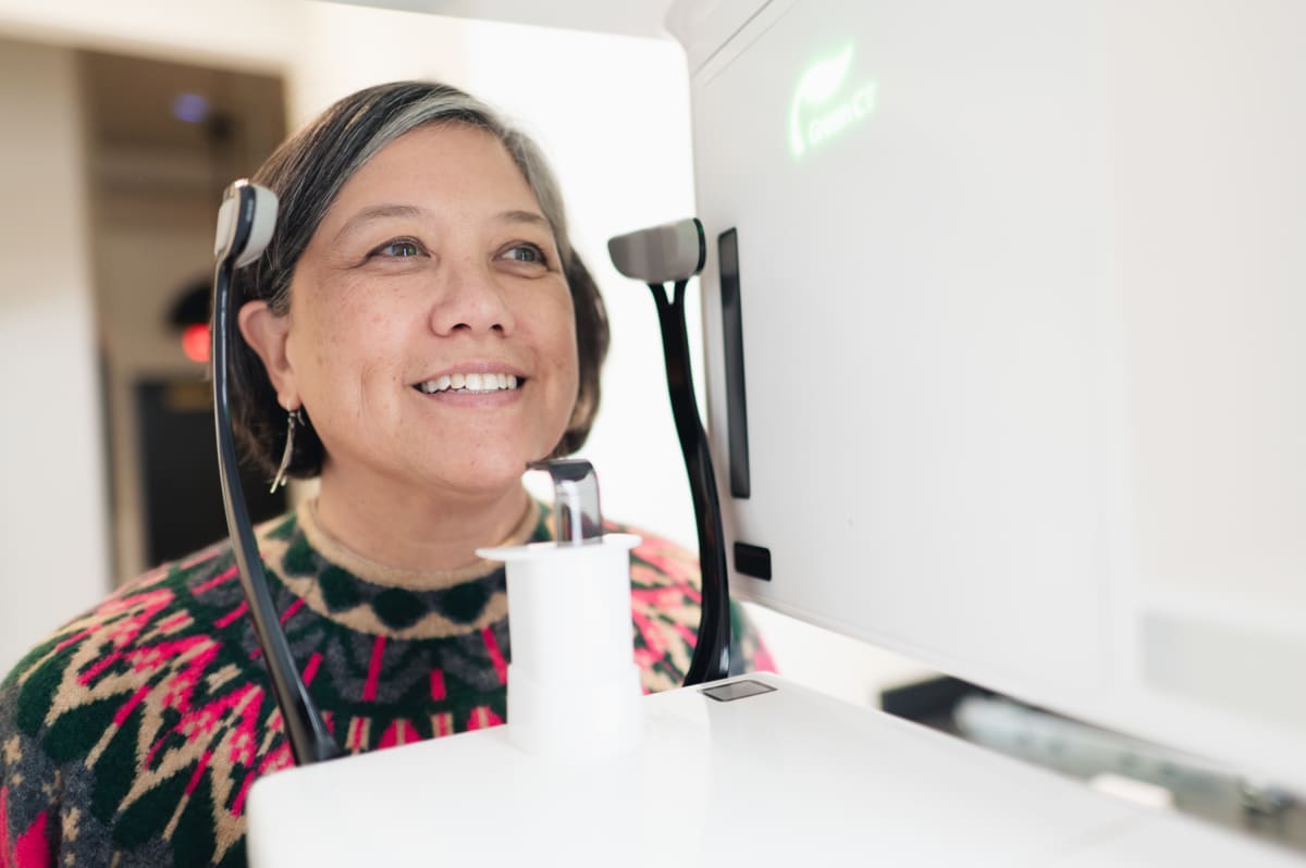 Patient smiling during veneer planning at Summit Dental Studio, showing cosmetic dentistry results