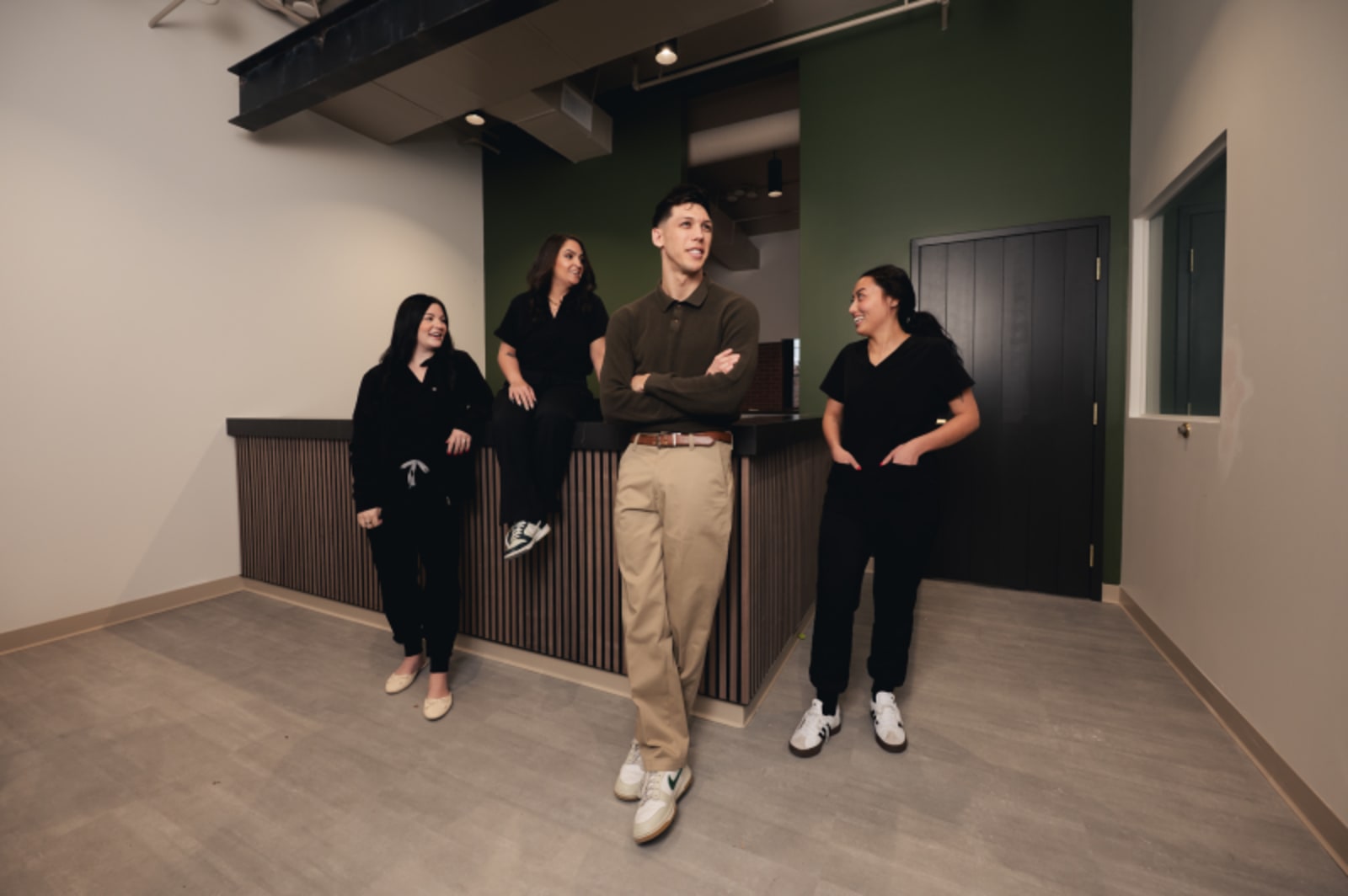 The Summit Dental Studio Team positing for group photo in lobby