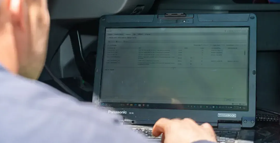 Mechanic performing diesel diagnostic testing