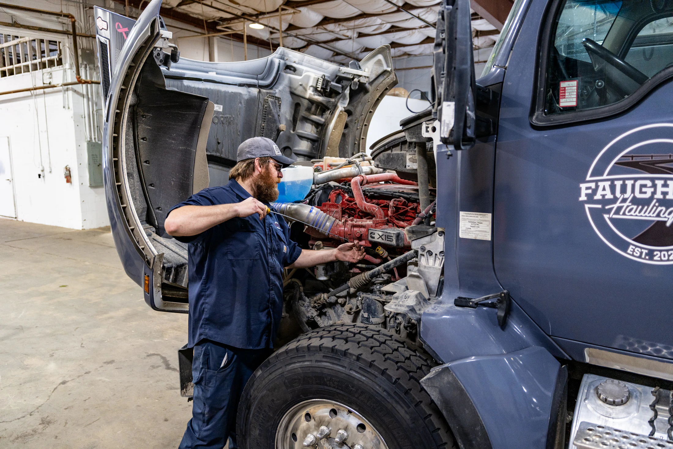 Diesel mechanic performing Preventive Maintenance in Norfolk, VA