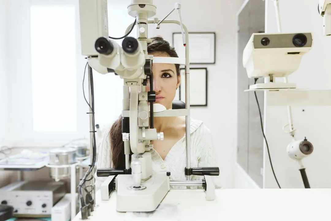 Patient undergoing eye examination with professional optical equipment