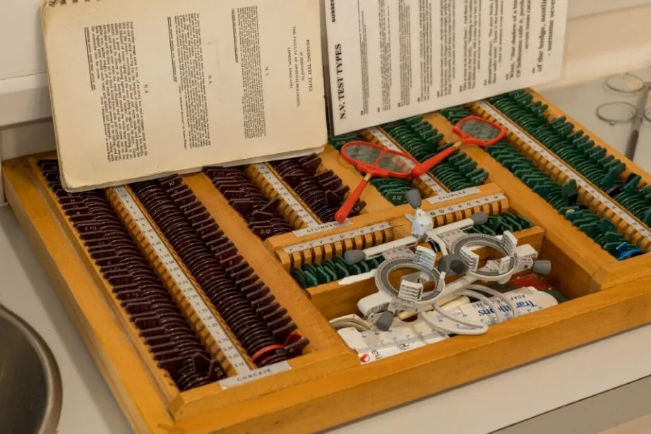 Vintage wooden box with microscope slides, medical testing equipment