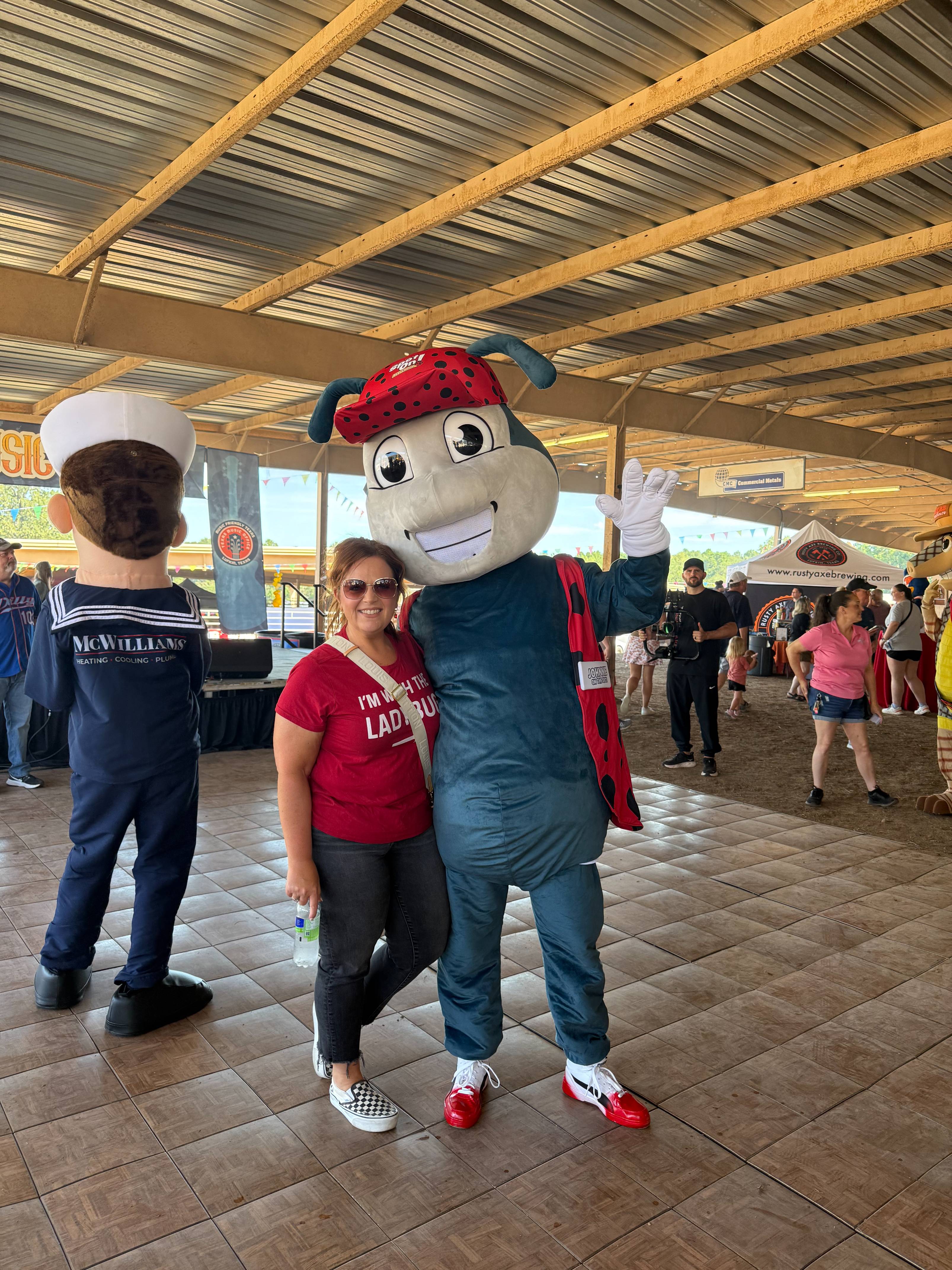 Woman with Spot On Ladybug mascot.