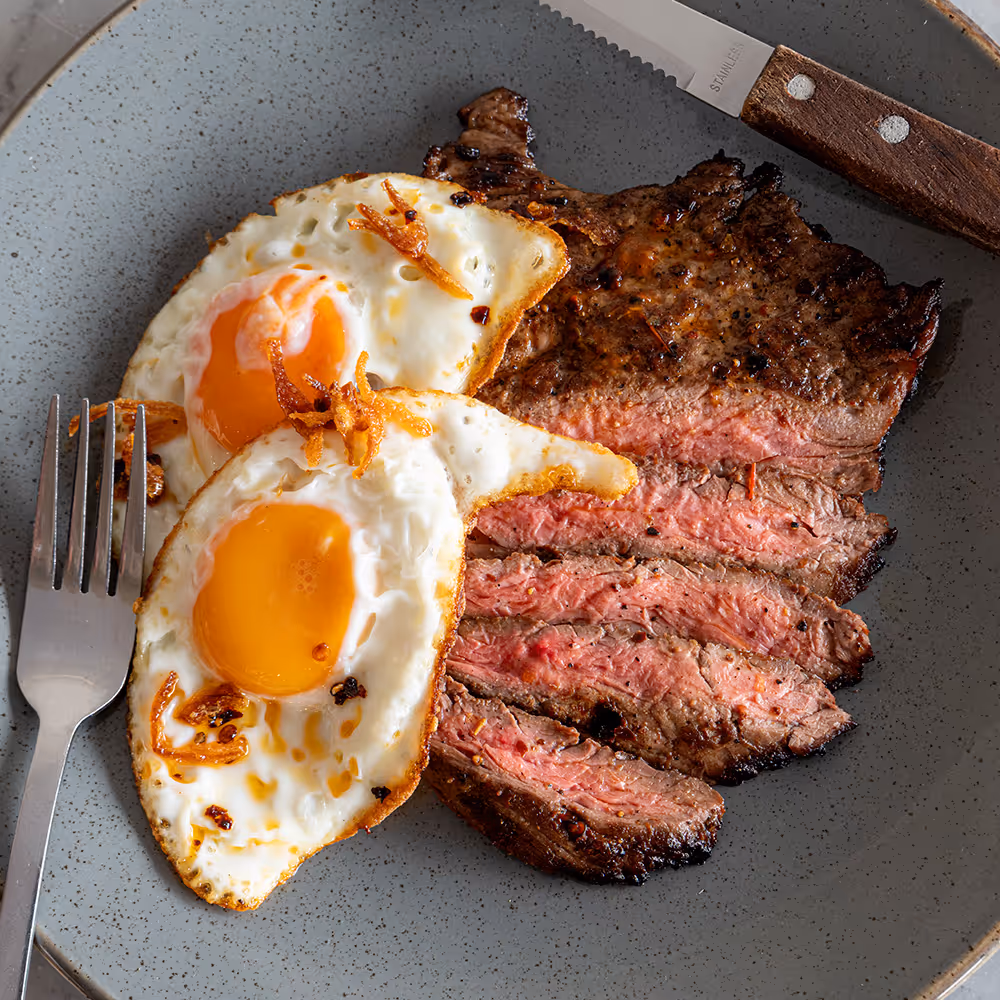 Fego Cafe Steak & Eggs with marinated bavette, chilli oil, fried eggs, rocket salad & house hash browns