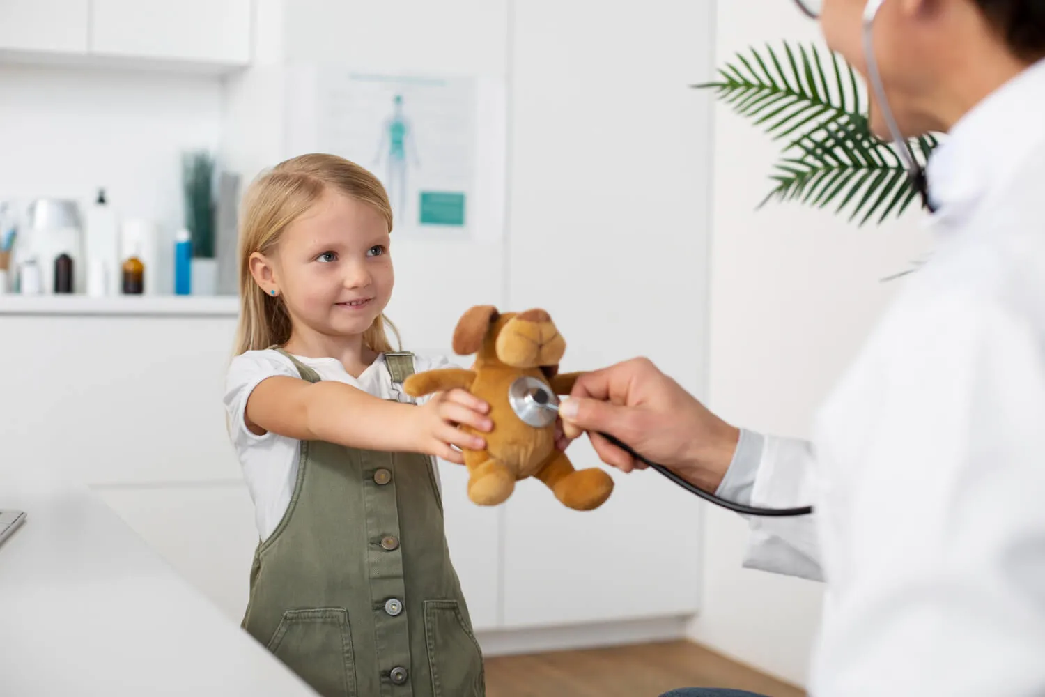 Child give a toy to doctor