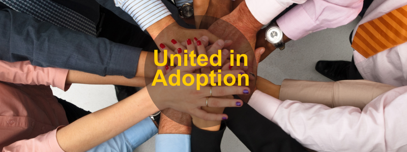 Diverse group with joined hands over text “United in Adoption,” illustrating importance of collaboration for change adoption.