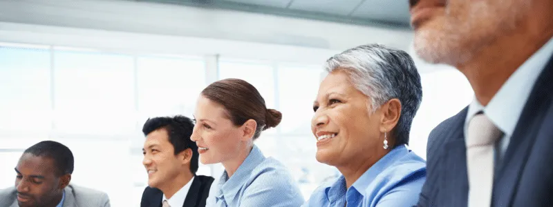 Close up picture of professionals of diverse ethnicities demonstrating leadership's role in customer advocacy success.