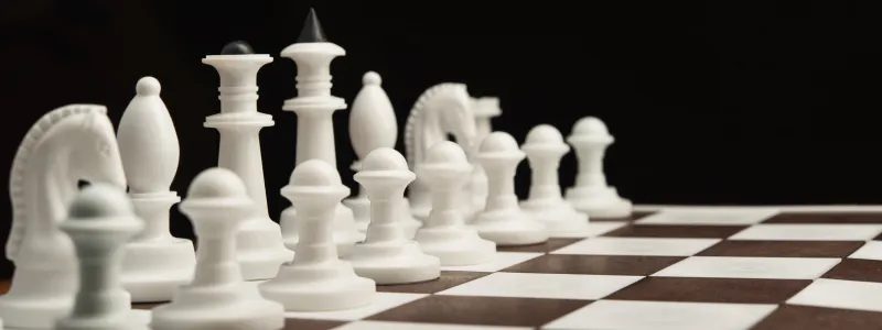 Picture of chess board with all white chess pieces showing. Prompting the question, are you a strategic advocacy manager?