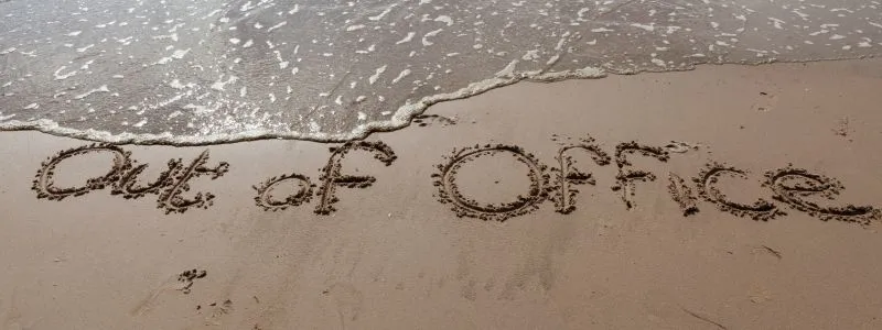 Scene of beach with words Out of Office as a reminder to not leave Advocacy Program unattended.